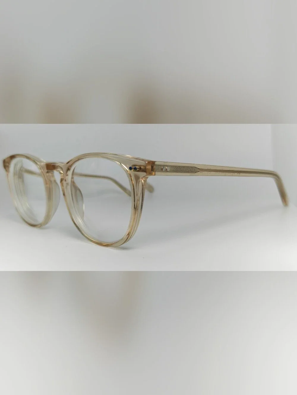 Ona. RFLKT. Clear Beige Round Frame Glasses.